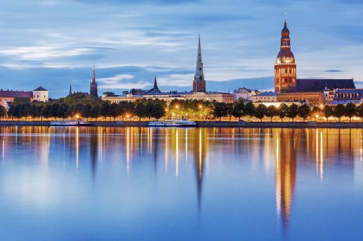 Riga, Latvia — evening panorama of the Old Town across the Daugava river